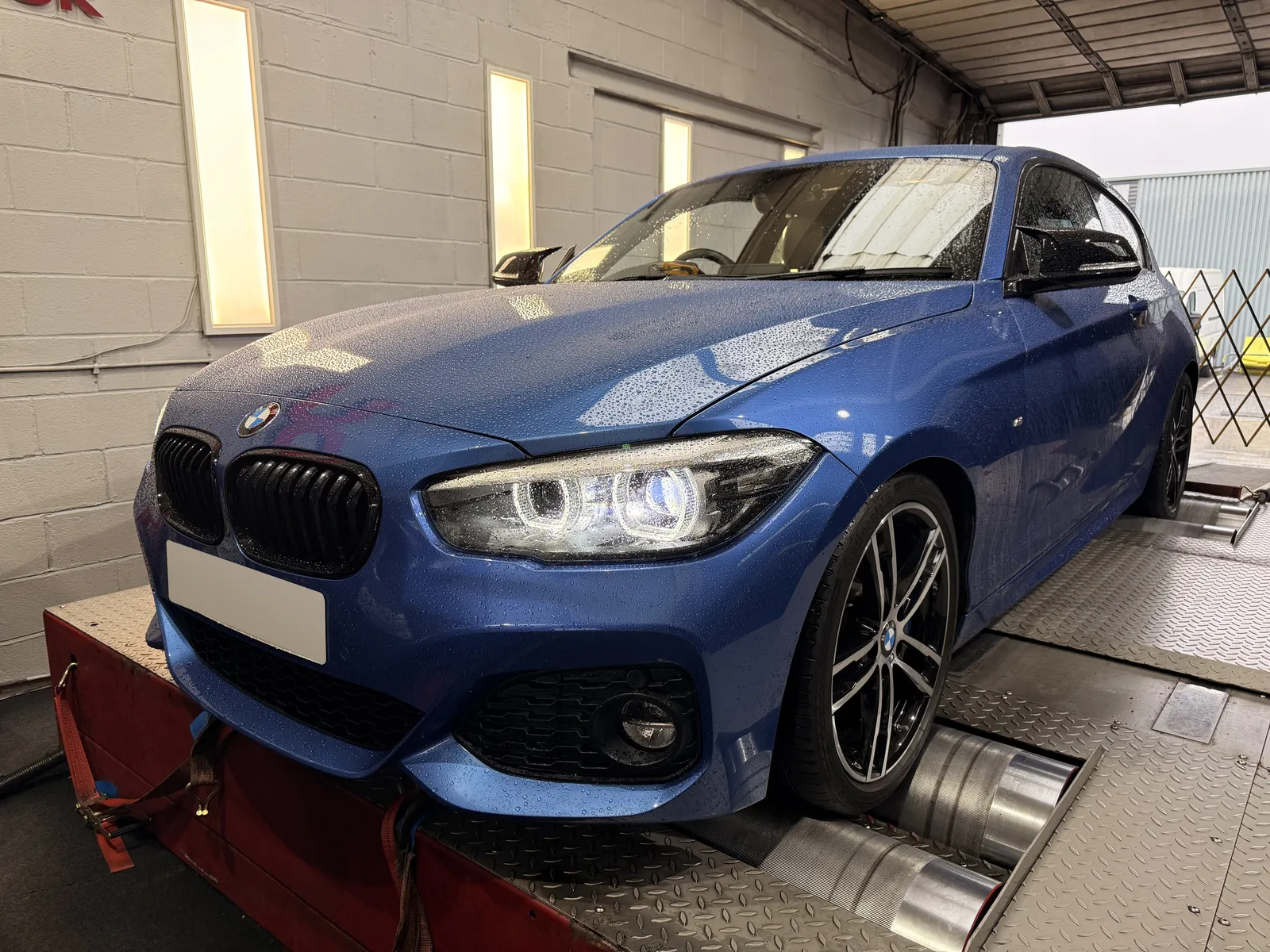 BMW 120i front three-quarter on the dyno