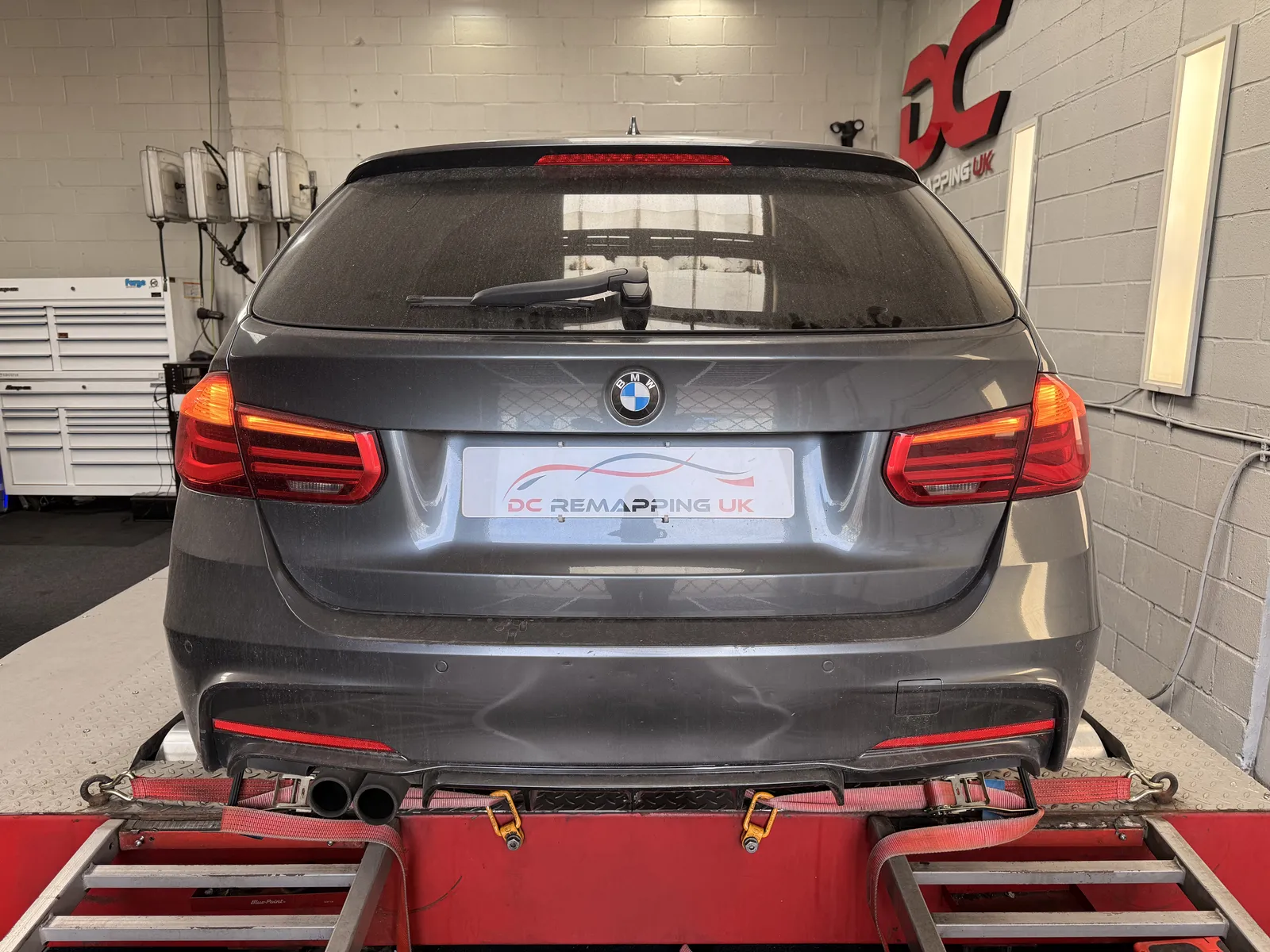 BMW 320i xDrive Touring rear view on the dyno