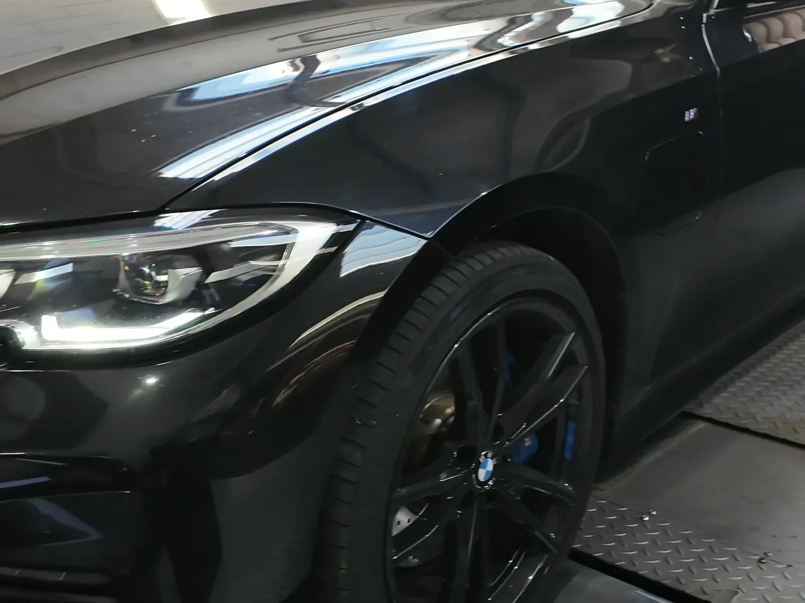 BMW 330e front three-quarter on the dyno