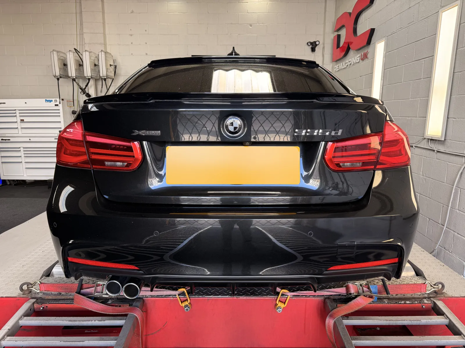 BMW 335d xDrive rear view on the dyno