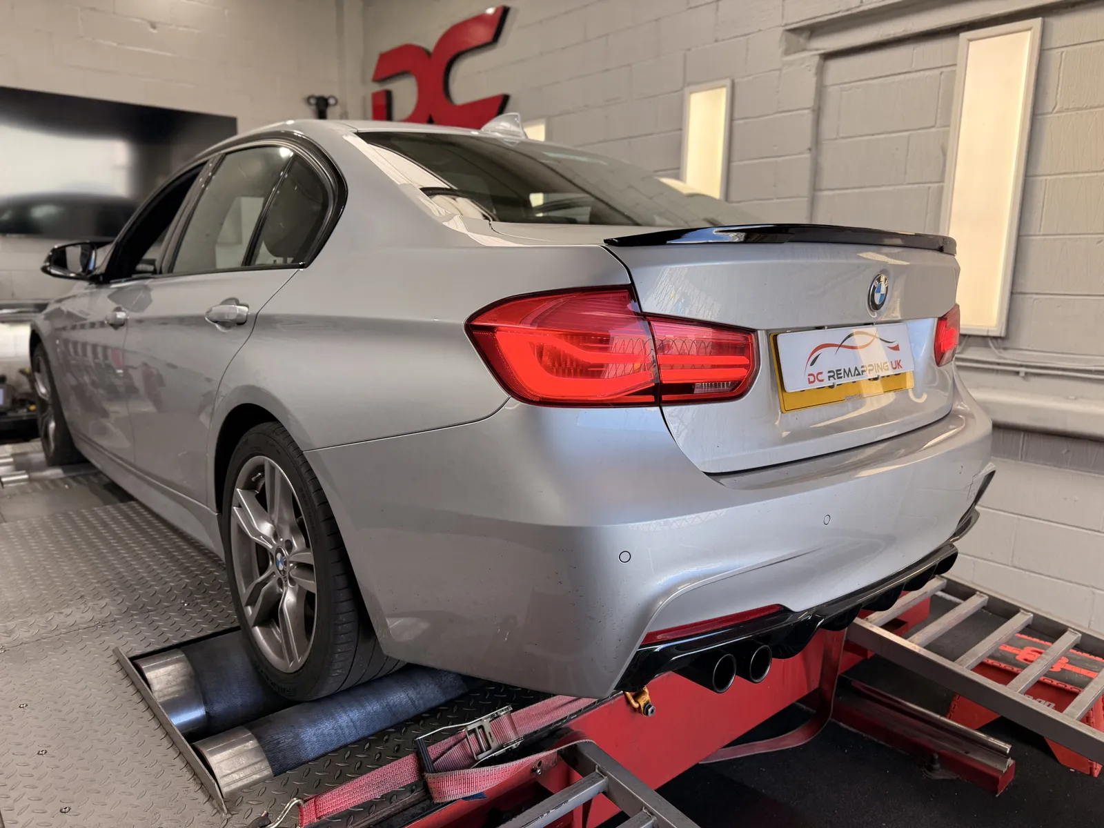 BMW 335d xDrive rear three-quarter on the rollers