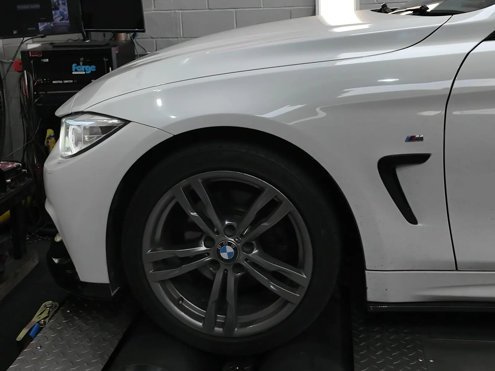 BMW 420i xDrive Gran Coupé front quarter on the dyno