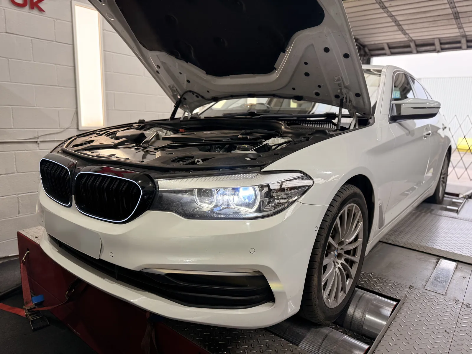 BMW 520d front three-quarter on the dyno, bonnet up