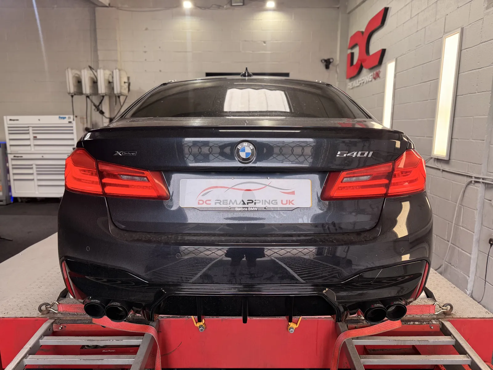 BMW 540i xDrive rear view strapped to the dyno