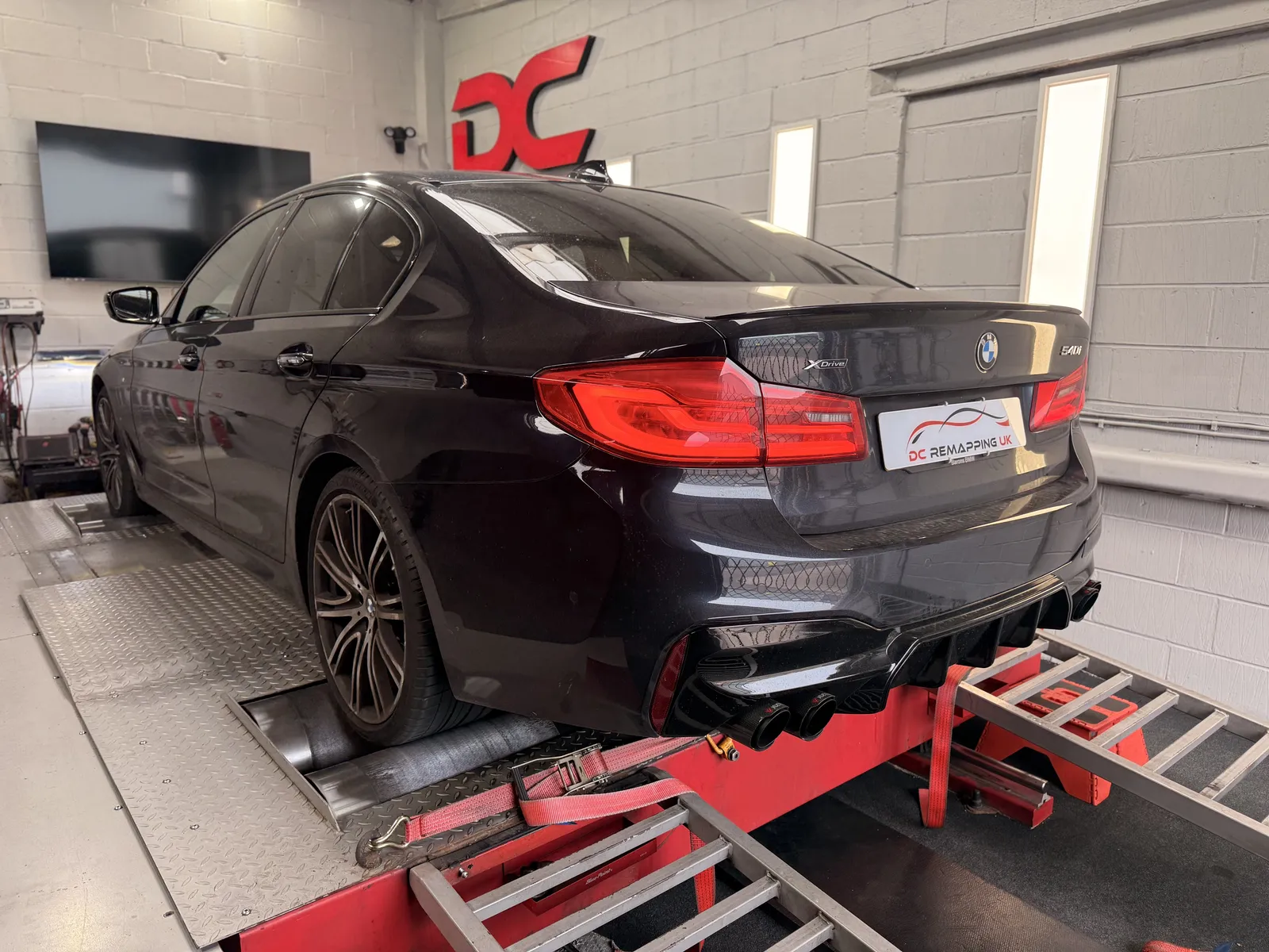 BMW 540i xDrive rear three-quarter on the dyno