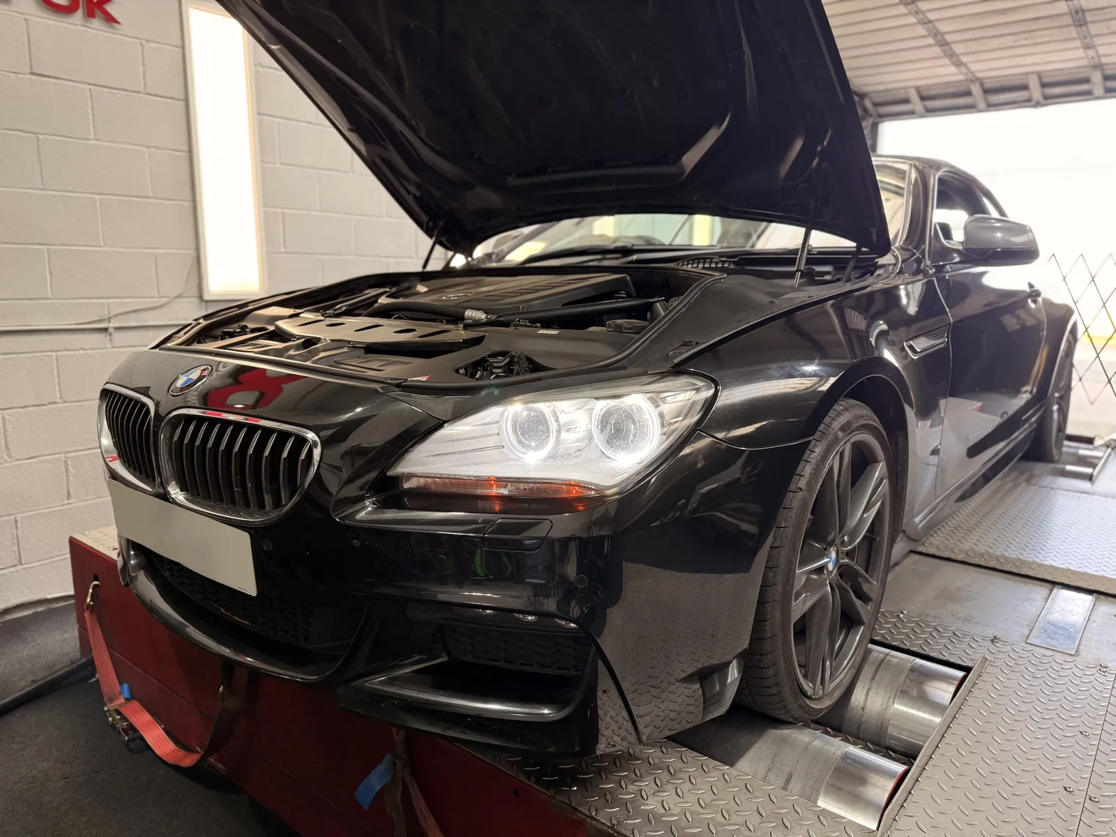 BMW 640d Convertible front three-quarter on the dyno, bonnet up