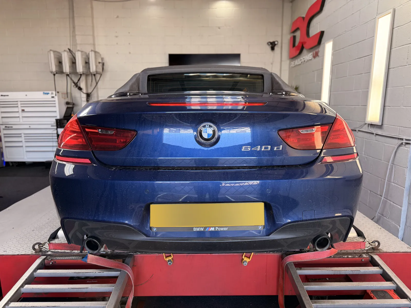 BMW 640d Convertible rear view strapped to the rollers