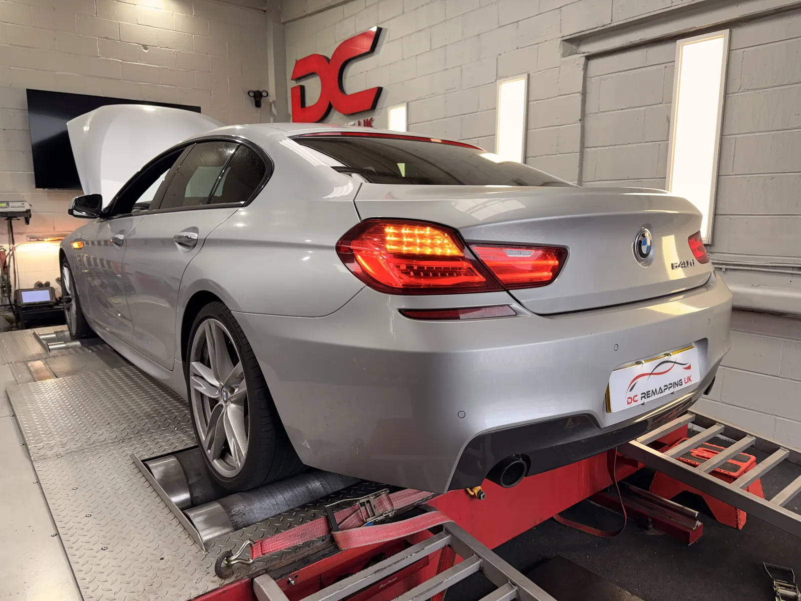 BMW 640d Gran Coupé rear three-quarter on the dyno