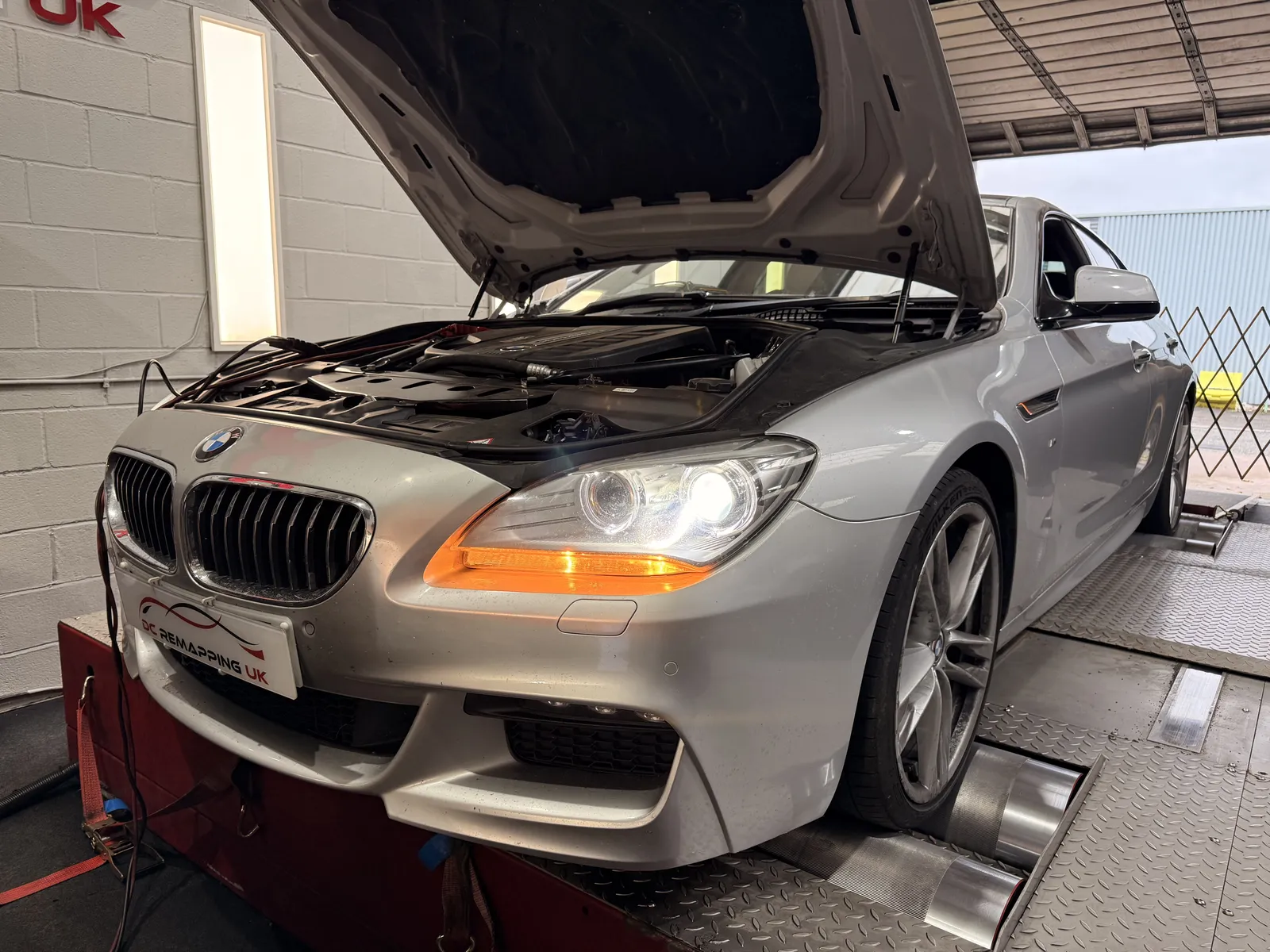 BMW 640d Gran Coupé front quarter with the bonnet up