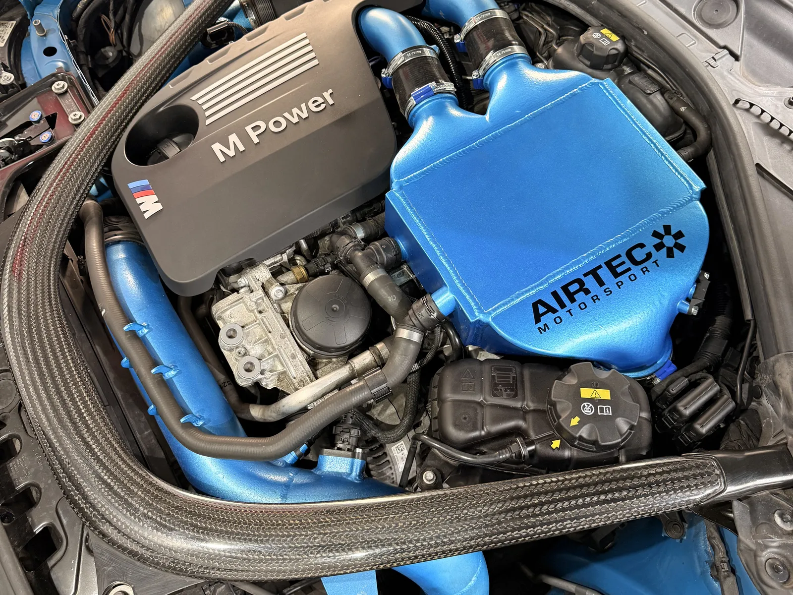 BMW M2 Competition S55 engine bay with the Airtec chargecooler