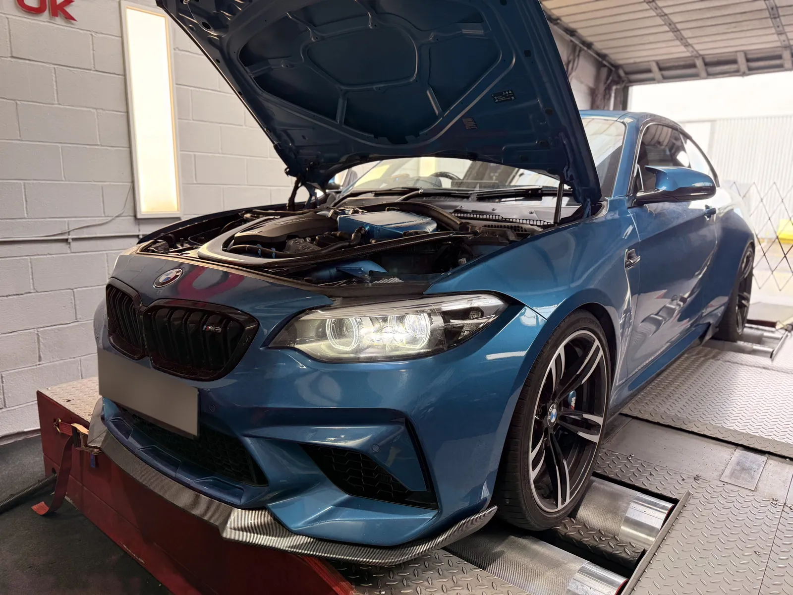 BMW M2 Competition front quarter with the bonnet up