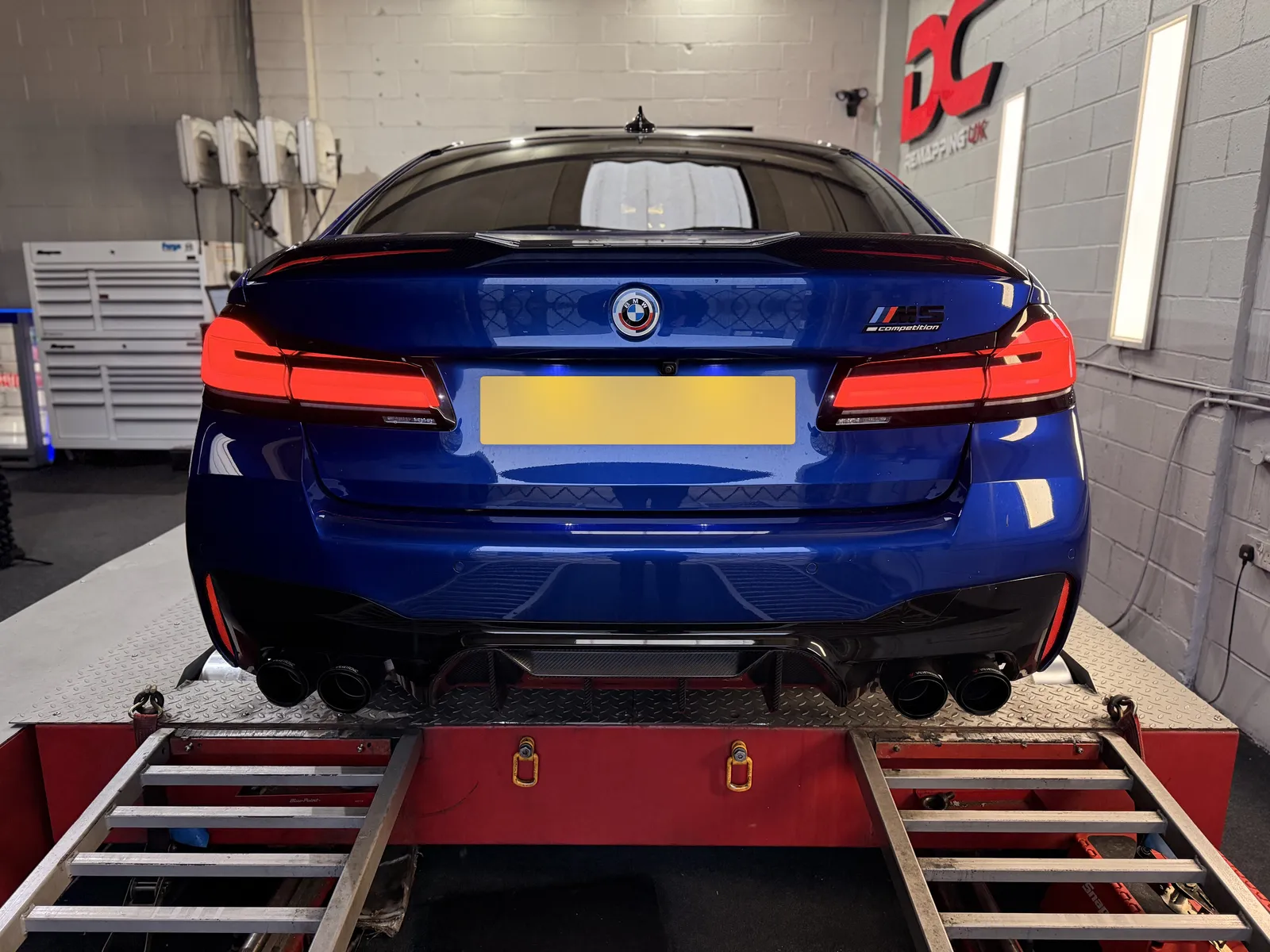 BMW M5 Competition rear view on the dyno, quad exhaust tips