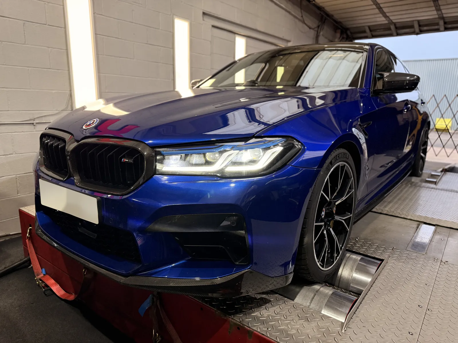 BMW M5 Competition front three-quarter on the dyno