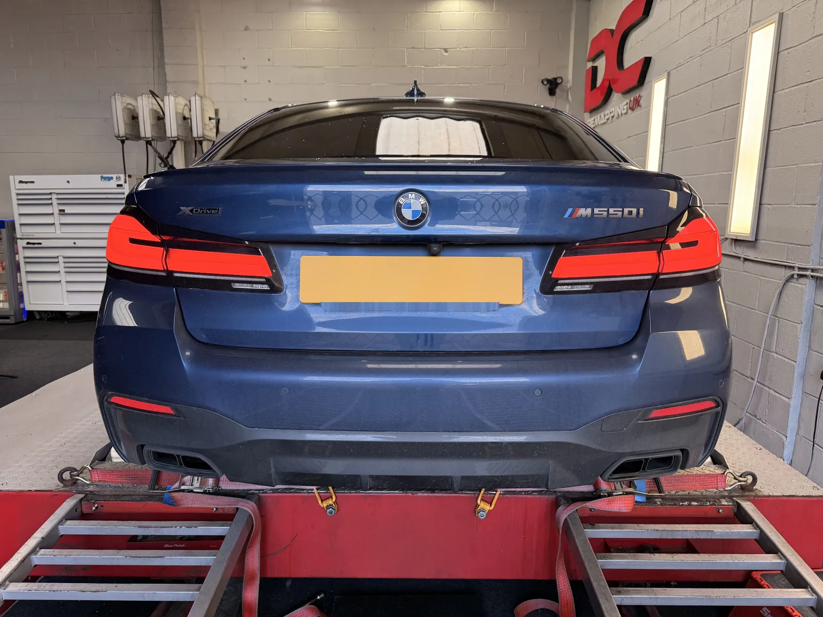 BMW M550i xDrive rear view on the dyno