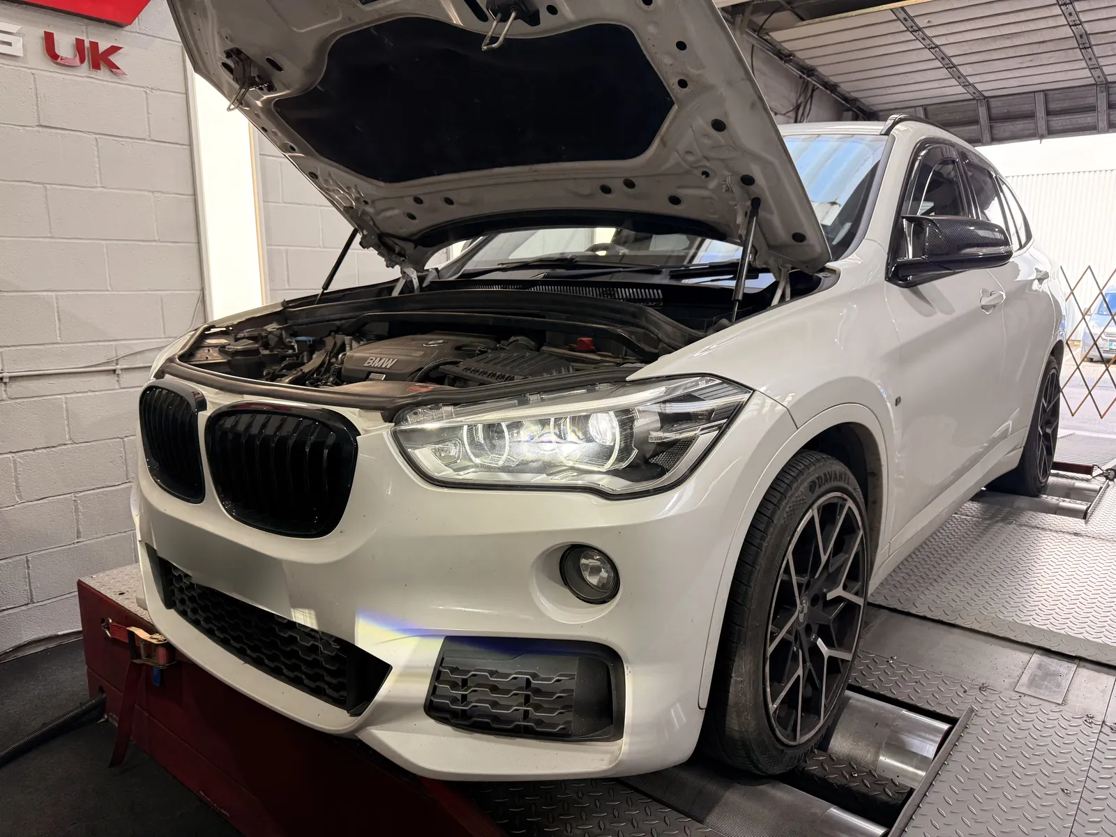 BMW X1 xDrive25d front quarter with the bonnet up