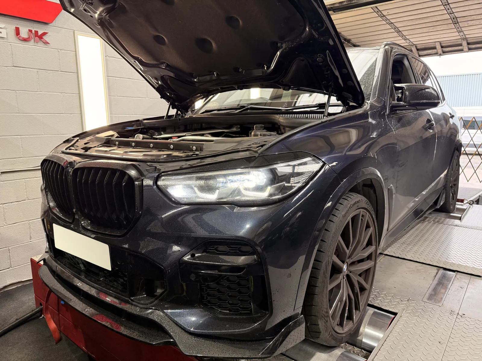 BMW X5 40d front three-quarter with the bonnet up