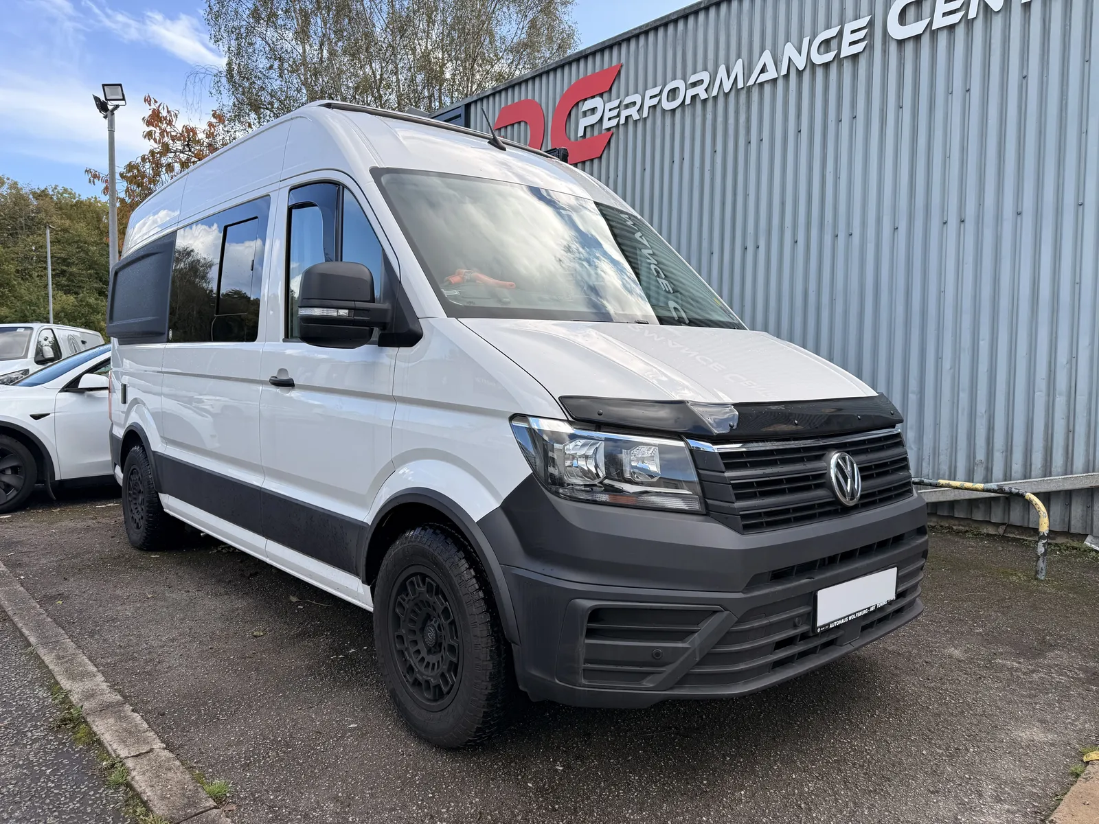 VW Crafter Camper front three-quarter outside the workshop